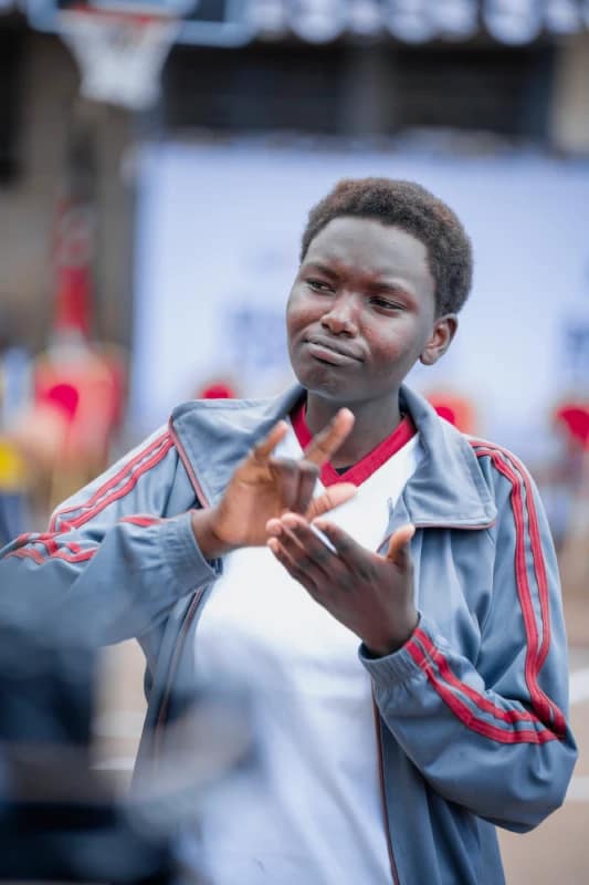 Basketball Experience Clinic for Deaf and Non-Deaf Students Lights Up Kinyanjui Road Primary School 4 A student with hearing impairment expresses herself through sign language during an interview at the basketball clinic